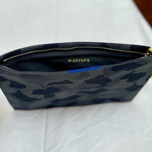 Rothy’s wristlet bag in black camouflage